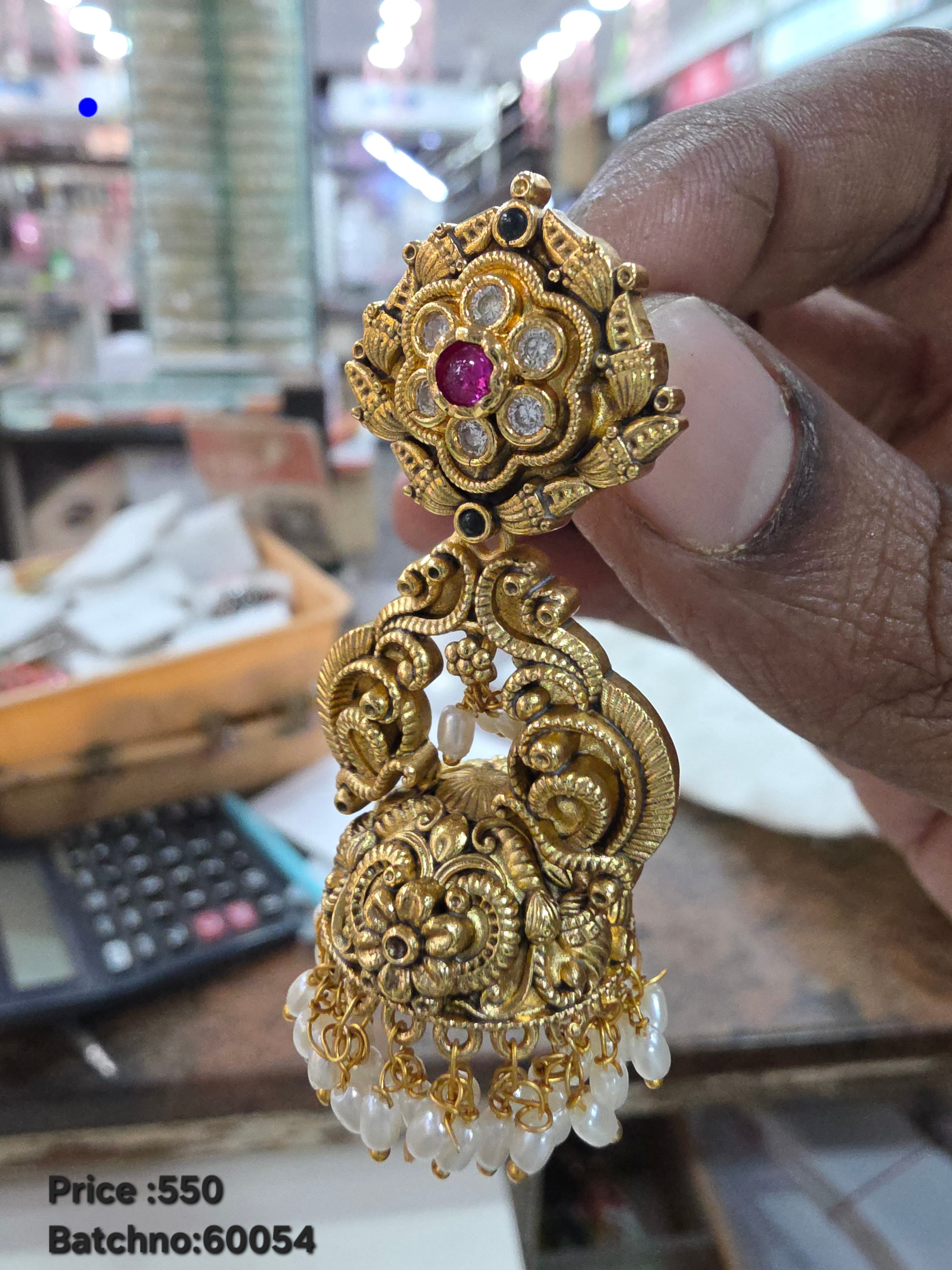 Antique jhumka with peacock design